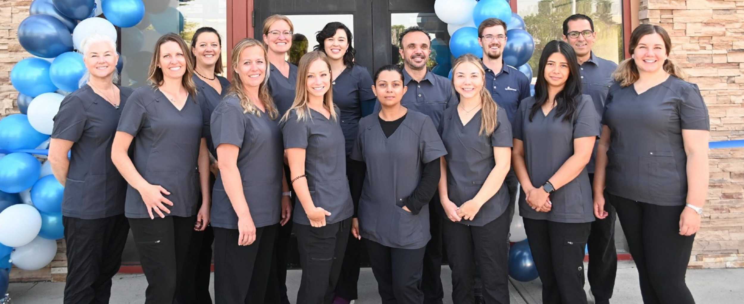 The Quest Braces team standing outside of their office