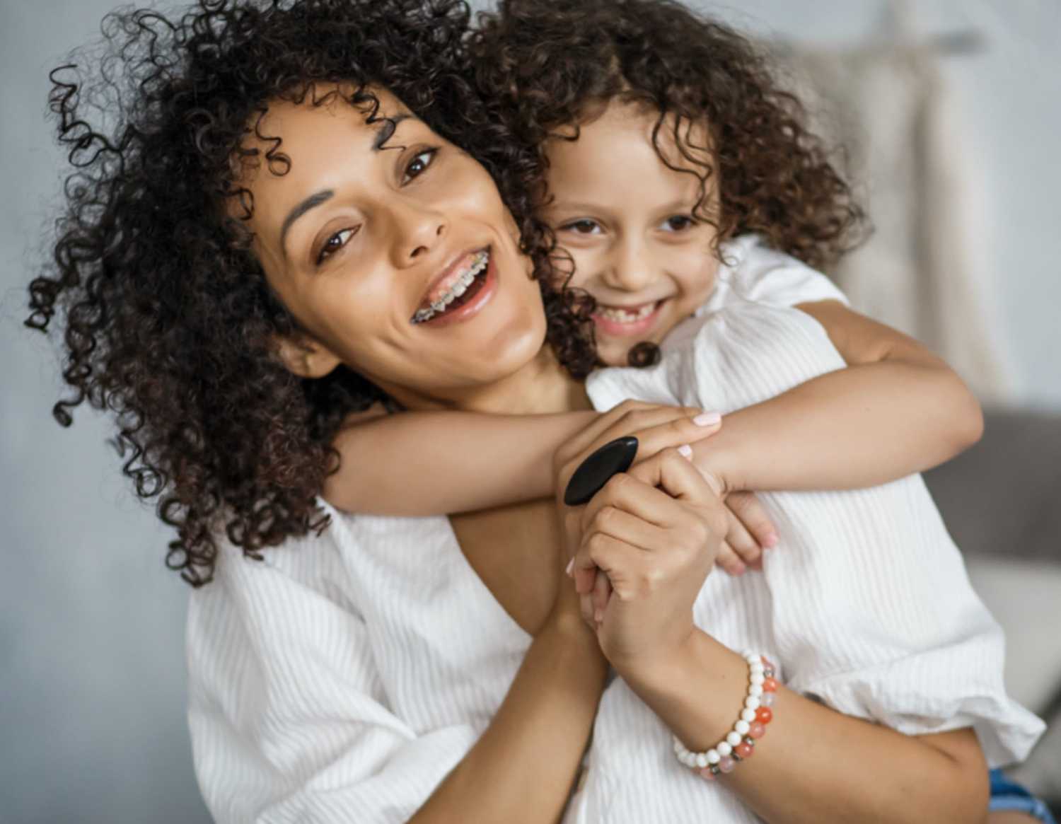 two people smiling and hugging